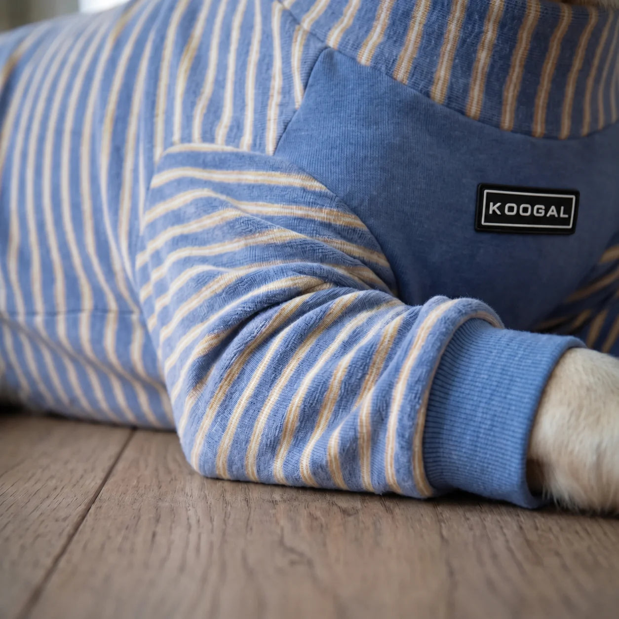 Close-up of the blue Labrador Four-Leg Lounge Onesie sleeve and chest detail